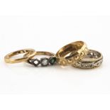 Four gold rings, including an 18ct gold diamond three stone ring, one setting vacant, ring size L,