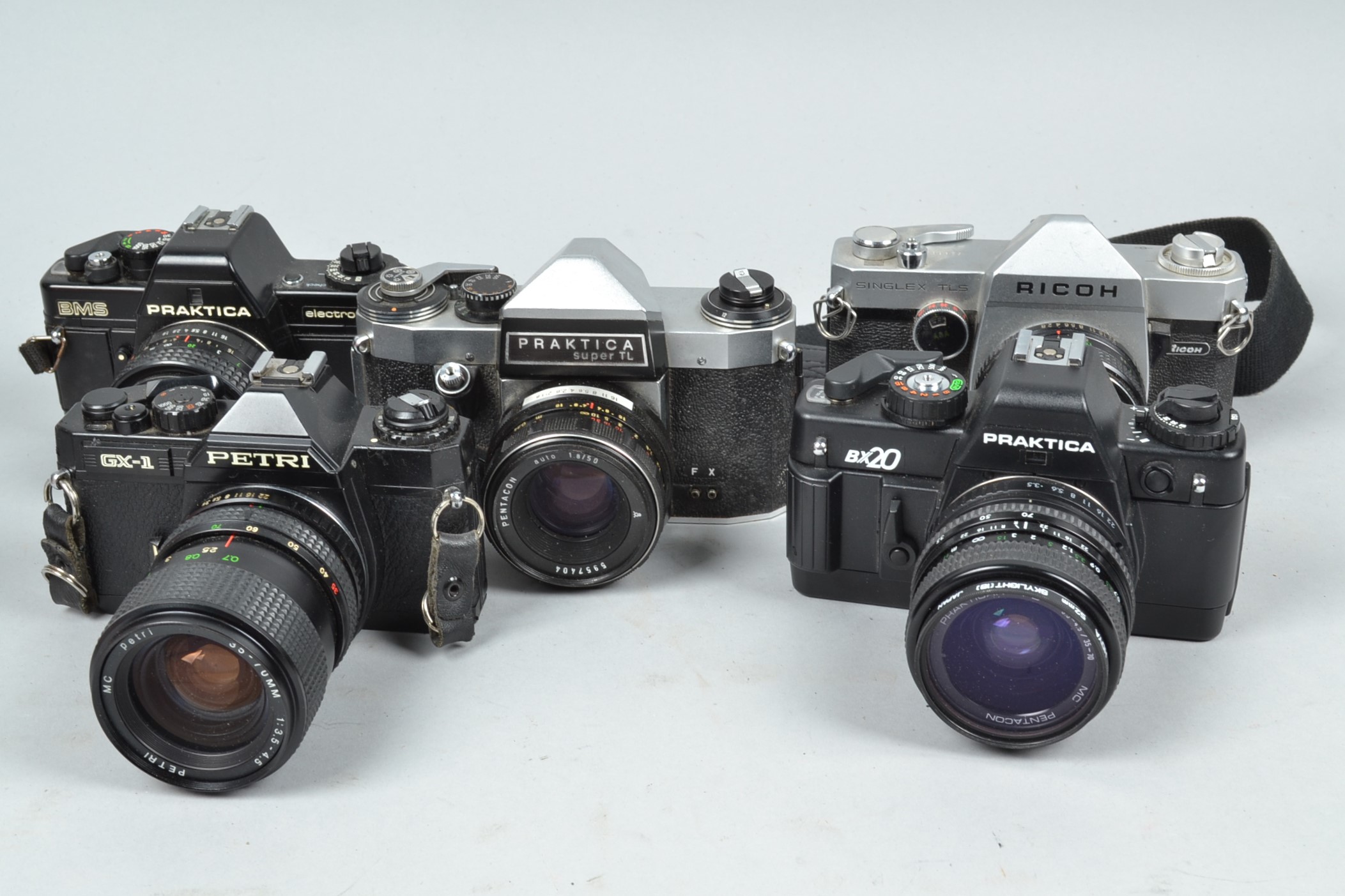 Five SLR Cameras, a Ricoh Singlex TLS, with 50mm f/2.8 lens, Praktica BX20, with 35-70mm f/3.5-4.5