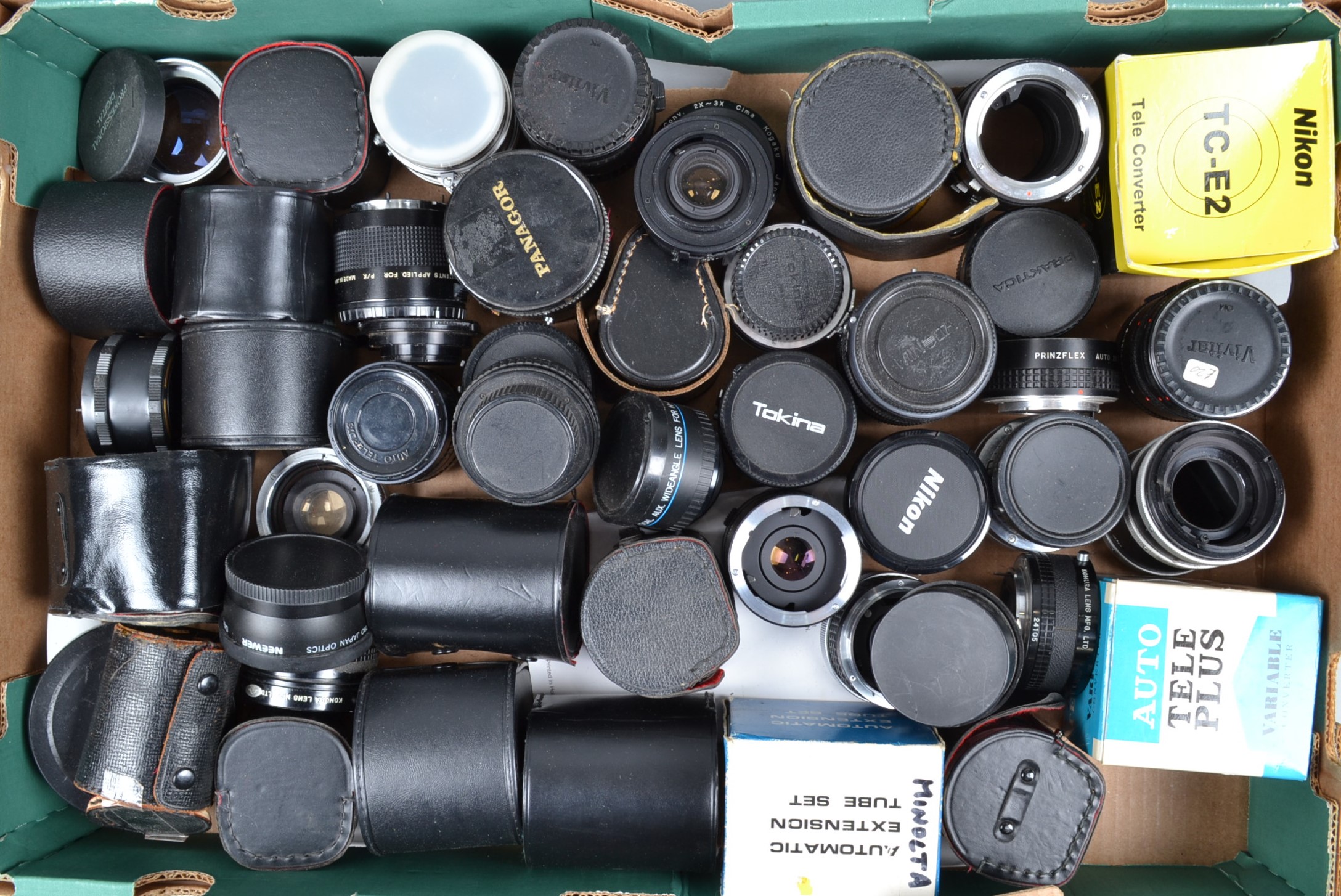 A Tray of Tele Converters and Extension Tubes maufacturers include Vivitar, Tokina, Nikon,