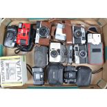 A Tray of Compact Cameras, including an Olympus 35RC, Pen, Yashica 35 ME, Ricoh FF-1s, Auto Half,