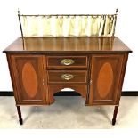 A Victorian mahogany sideboard, two cupboards and two drawers, having inlaid wood, with brass