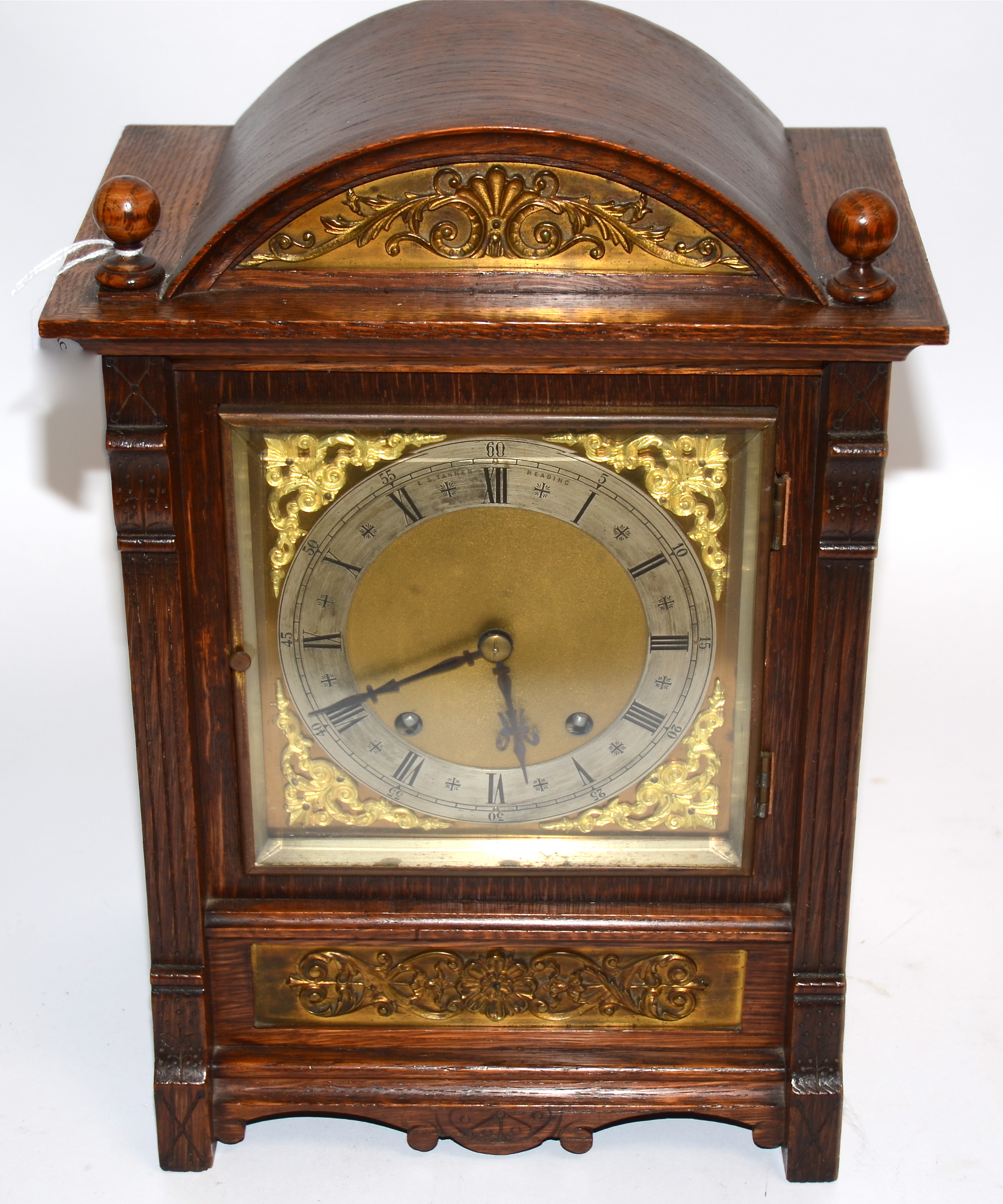 A Victorian oak eight day movement mantle clock, of domed shape, the silvered dial with filigree