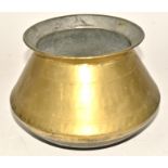 A Middle Eastern brass cooking pot, of bulbous form, on a concave base, with bands of decoration,