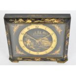A 20th Century Chinoiserie gilt and ebonised mantle clock, the dial with Arabic numerals, with