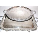 An Oetzmann & Co of London twin handled rectangular silver plated tray, raised on four rococo