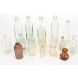 A small quantity of collectable glass bottles to include 'Veno's Lightning Couch Cure', height 14cm,