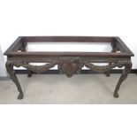 A George II style mahogany Irish side table, base only, frieze applied with egg, dart, flower and