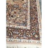 A 20th Century Nain Persian woollen rug, on an ivory field, with an all over profusion of flowers