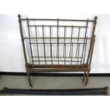 A Victorian single bed, with brass head and foot, metal side rails and a later slated wooden base
