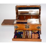 An oak and silver plate mounted Tantalus, with drinks compartments, lockable internal divisions