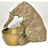 An early 20th Century novelty cigar cutter taking the form of an elephant, with trunk reaching