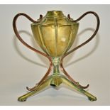 Manner of W A S Benson, a copper and brass oil lamp base, supported on a tri-form base, height 17cm