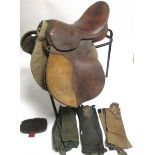 A leather horses saddle and stand, approximately 90cm x 45cm, (5)