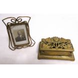 An Art Nouveau brass photograph frame, 9cm x 7cm, together with a cast brass stamp box with