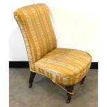 A Victorian nursing chair, with mahogany supports and neo-classical style upholstery