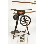 A Hobbies fret saw, height 90cm, adjustable, together with a folio of designs (2)