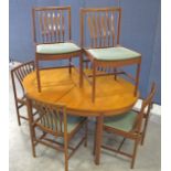 A mid-Century teak dining suit, possible Danish design, comprising an oval draw leaf table with fold