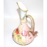 A Royal Worcester hand painted ewer with handle in the form of a mythical scaly creature, with