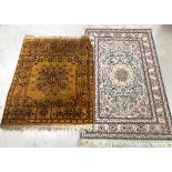 Two small rugs, one silk, the other yellowish woollen (2)