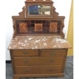 An Edwardian walnut tiled backed wash stand, two short over two long drawers to base, panelled