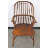 A contemporary Windsor arm chair, curved high back with parallel spindles, crinoline stretcher,
