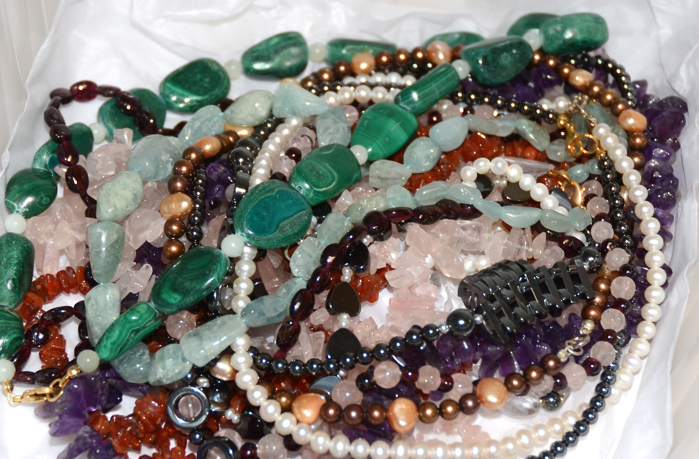 A malachite pebble necklace, together with several other costume jewellery necklaces including