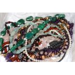 A malachite pebble necklace, together with several other costume jewellery necklaces including