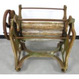 A vintage cast iron Stowaway washing mangle, in need of restoration