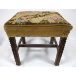 An antique mahogany stool, with square chamfered moulded legs, united by an H stretcher, floral