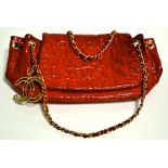 A Chanel red patent 'Puzzle' design handbag, with chain straps, approximate dimensions 24cm x