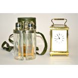A three sectioned hip flask holder, the three inner bottles fitting together to a cylindrical shape,