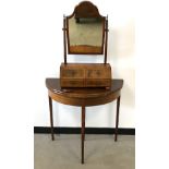 A Victorian walnut veneered toilet mirror, shaped mirror on two supports over base with four