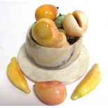 An onyx hardstone bowl with carved fruits, to include bananas, apples, grapes and pears, and