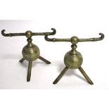 Manner of Christopher Dresser (1834-1904), a pair of late 19th Century brass andirons, considered to