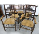 A set of seven late 19th Century north country beech and elm ladder back chairs, including five