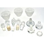 A small quantity of glass stoppers for decanters, of various forms and three moulded glass bowls (