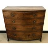 An early Victorian mahogany veneered bow front chest of drawers, four long drawers with brass