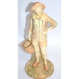 James Hadley for Royal Worcester, a youthful young male figure with a basket, possibly a European