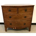 A late Victorian bow front mahogany veneered chest of drawers, two over three with shaped apron,