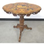 A 19th Century walnut Black Forest tilt top tripod table, marquetry top inlaid with Goats, Deer