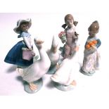 Three Lladro figures of girls, 5217 girl with songbird, 4841 girl with oranges and a girl with a