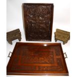 An early 20th Century oak twin handled tray with an embossed cherry and foliate design, together