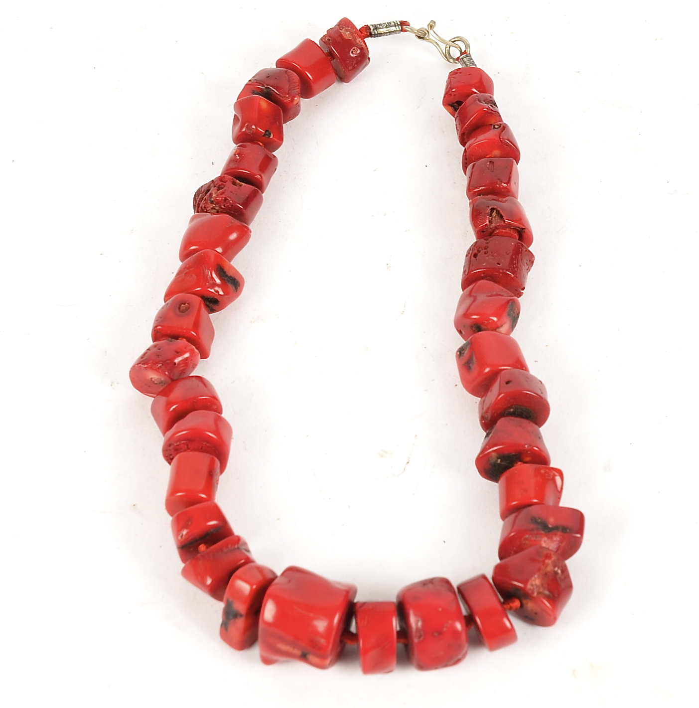 A coral necklace, with irregular polished coral cubes, length 24cm