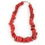 A coral necklace, with irregular polished coral cubes, length 24cm