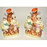 A pair of Victorian Staffordshire figures with young children playing as farmers, height 21cm (2)