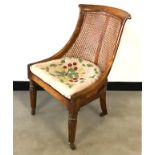 A Victorian rosewood slipper / sabre chair, fluted front supports, sabre back legs, rattan seat