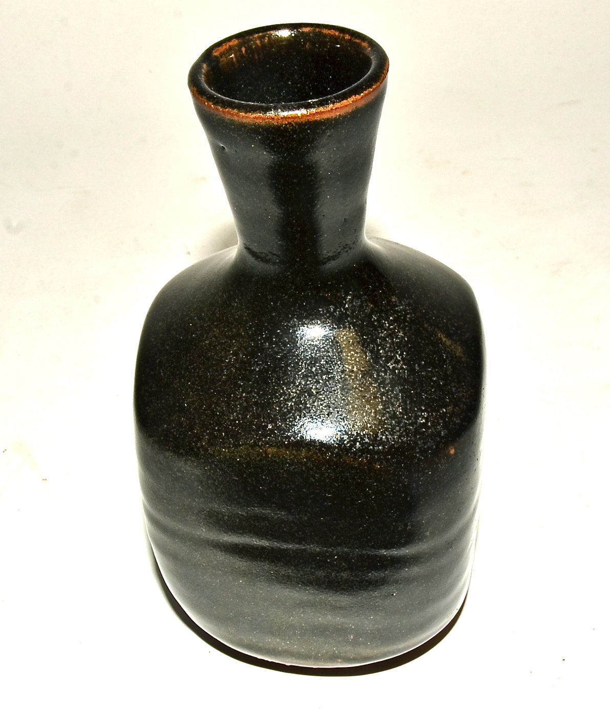 Shigeyoshi Ichino (1942-2011) a St Ives stoneware square formed bottle vase, tenmoku layered glaze