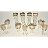Four etched and gilt heightened Continental glasses possibly by Moser, height 17cm, together with