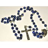 An Italian lapis lazuli rosary, consisting of strung beads, crucifix and prayer to Mary, length 58cm