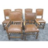 A set of four 1920s Oak dining chairs, upholstered in a brown Rexine fabric with metal studding,